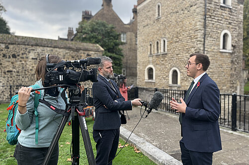 Tom Gordon with the press on College Green