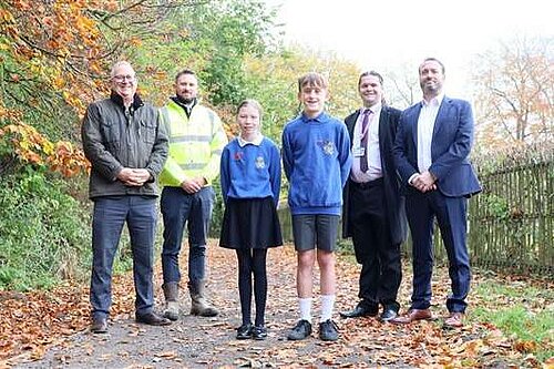 Cllr Jon London standing on the new path