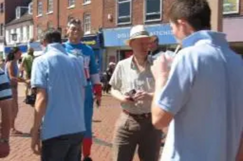 Stephen Robinson hands out Make Trade Fair pledge cards