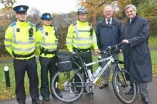 PCSOs Ed Pritt and Michelle Towle and PC Gavin Smith receive one of two new bikes from the Borough's Community Safety Partnership Manager, Peter Baldry and Eastleigh MP Chris Huhne