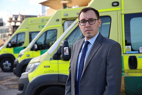 Tom stood in front of ambulances at Harrogate District Hospital