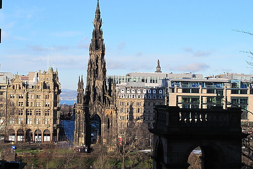 The Walter Scott Monument, a large spire, with Princes Street in the background.