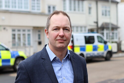 Richard Foord stood in front of a Police van