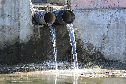 Dirty Water Pouring out of Pipes