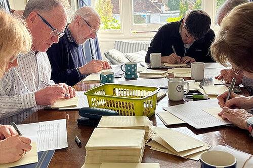 Volunteers addressing letters