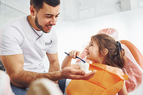 Dentist with young patient