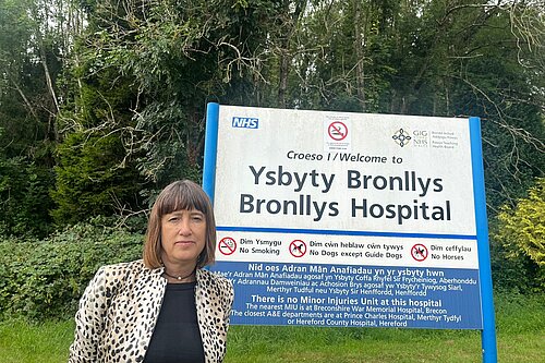 Jane Dodds MS in front of local hospital