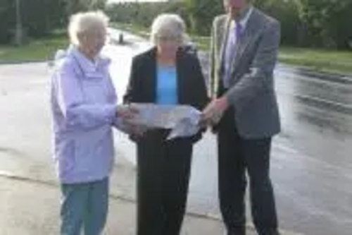 Christine Akers, Pat Brooks and Phil Chadburn study details of the safety measures.