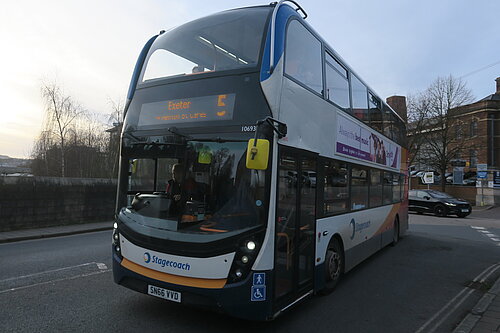 The number 5 bus crosses New North Road bridge heading towards Exeter City Centre